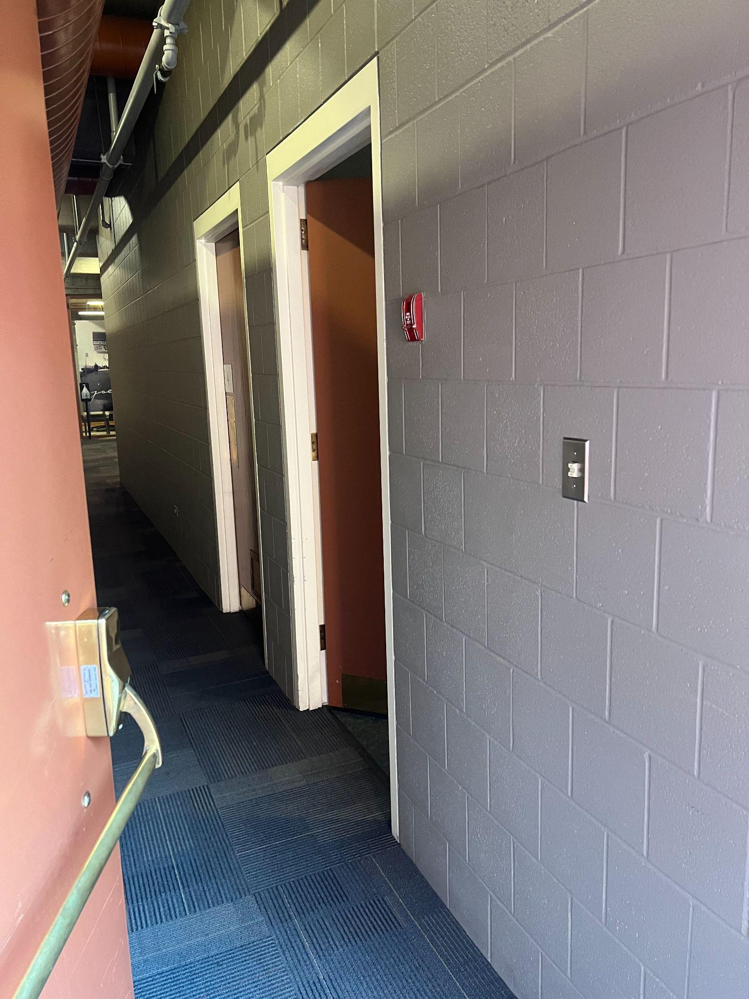 View as the crash door opens into the Administration area where an accessible washroom is located to the immediate right.